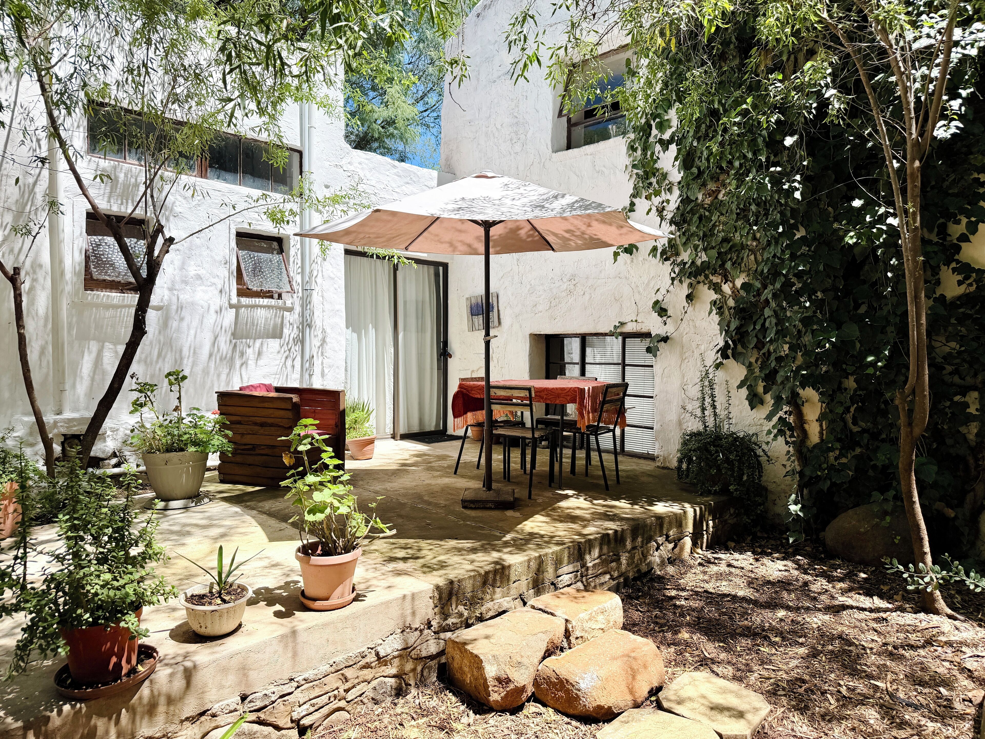 Family Room, Patio, Garden View | Outdoor dining | Breakfast, lunch, brunch served; garden views