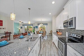 Fridge, microwave, oven, stovetop - 6BR Pool+Spa | The Retreat ChampionsGate | Disney 10 min (Davenport)