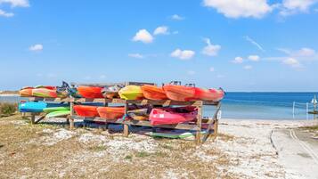 A wooden structure with kayaks.