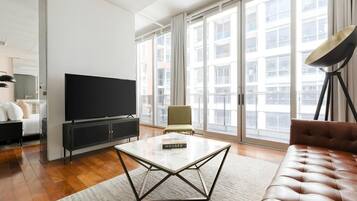 Suite Deluxe, balcon | Aire de séjour