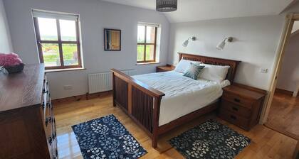 Spacious 4-bedroom house in charming Glin perfect for your Ireland getaway