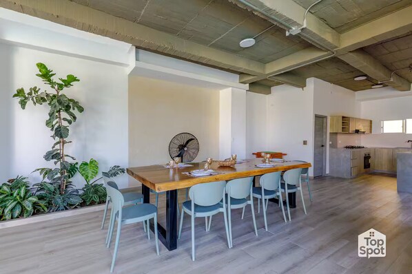 A modern kitchen with wooden cabinets and a built-in oven.