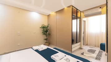 Deluxe Apartment, 3 Bedrooms, Balcony, City View | In-room safe, blackout drapes, iron/ironing board, free WiFi