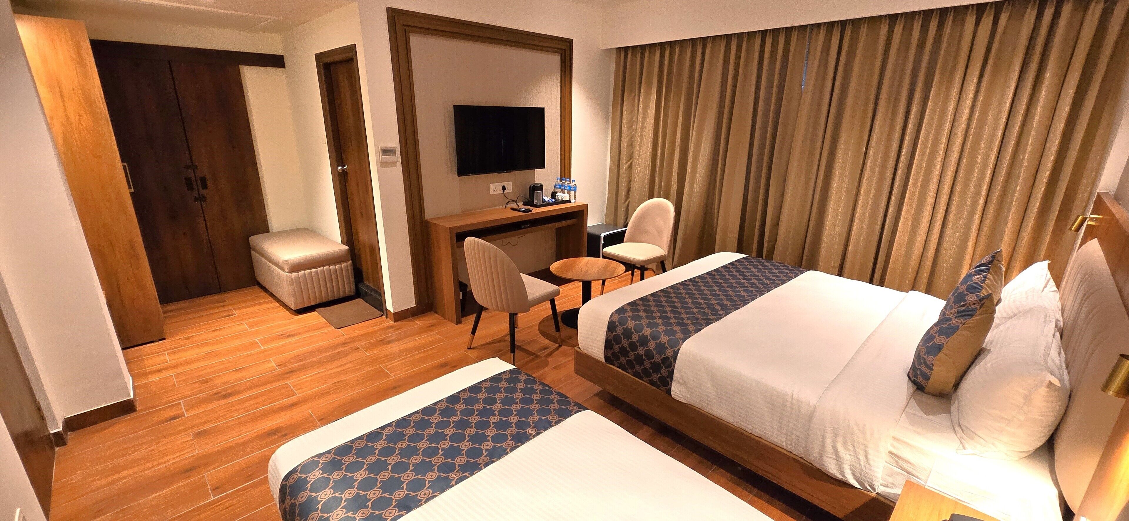 Deluxe Triple Room, City View | Premium bedding, down comforters, memory foam beds, desk