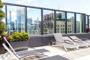 Terrace/patio - Stylish 1BR Retreat at The Olivia w Rooftop Garden (New York)