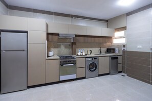 Deluxe Apartment, 4 Bedrooms, Balcony, City View | Private kitchen - Beithady Luxury Aparthotel Lotus - BH-73 (New Cairo)
