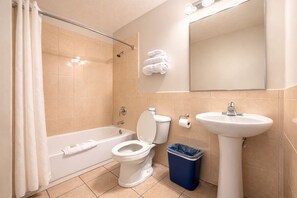 Bathtub, towels, soap, shampoo