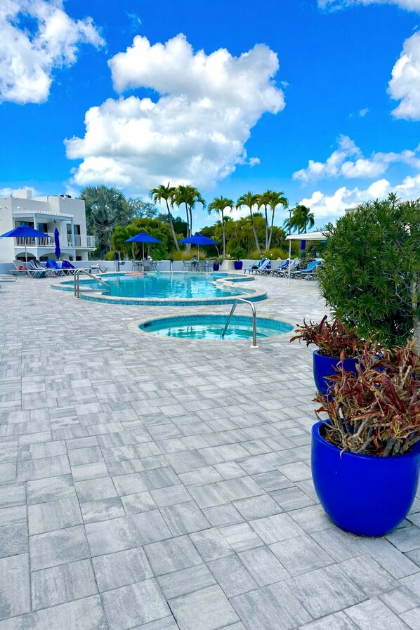 Outdoor pool, a heated pool - Sunny Naples Getaway- 2BR Condo with Pool, Tennis, & Minutes to Beach (Naples)