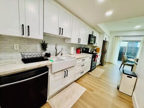 Fridge, microwave, oven, stovetop - Resort-Style Condo in Gated Community near 6-8 Water Polo Academy, Disney, Beach (Fountain Valley)