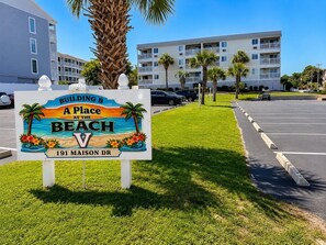 A sign for a building at the beach with a view, located at 191 Maison Dr. - Ocean View Condo Steps from the Beach (Myrtle Beach)
