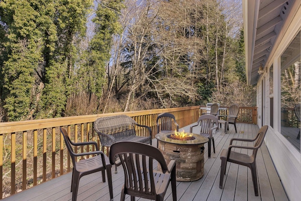 Private deck with fire pit & seating—perfect for relaxing evenings under the coastal sky.