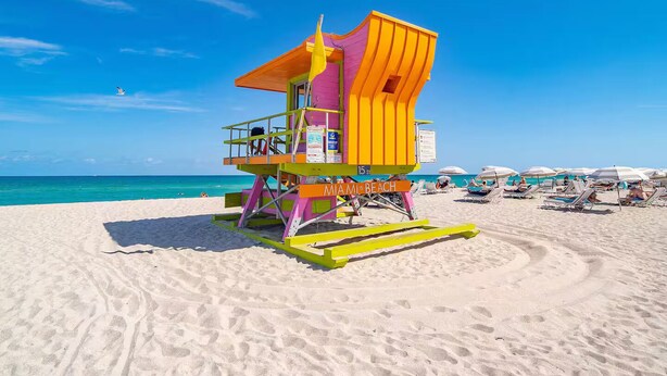 A lifeguard tower on a beach with clear blue skies. - South Beach 2BR Condo Walk to Beach  (Miami Beach)