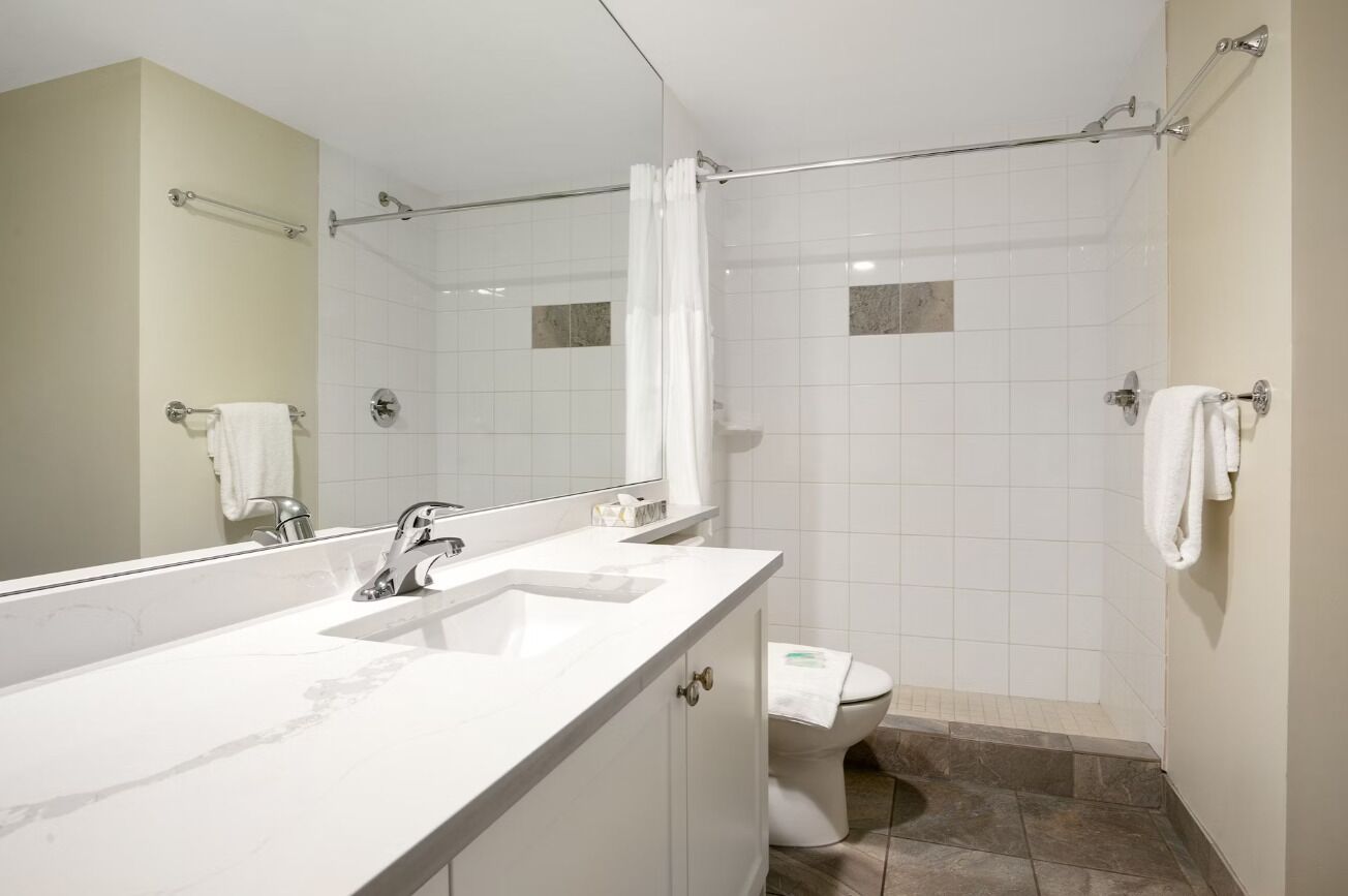Refresh effortlessly in a spotless bathroom with roomy shower.