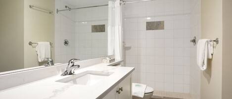 Refresh effortlessly in a spotless bathroom with roomy shower.