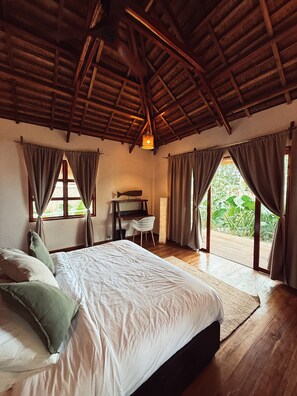 Deluxe Suite, Beach View | In-room safe, desk, laptop workspace, blackout drapes - Baia beachfront boutique lodge (San Vicente)