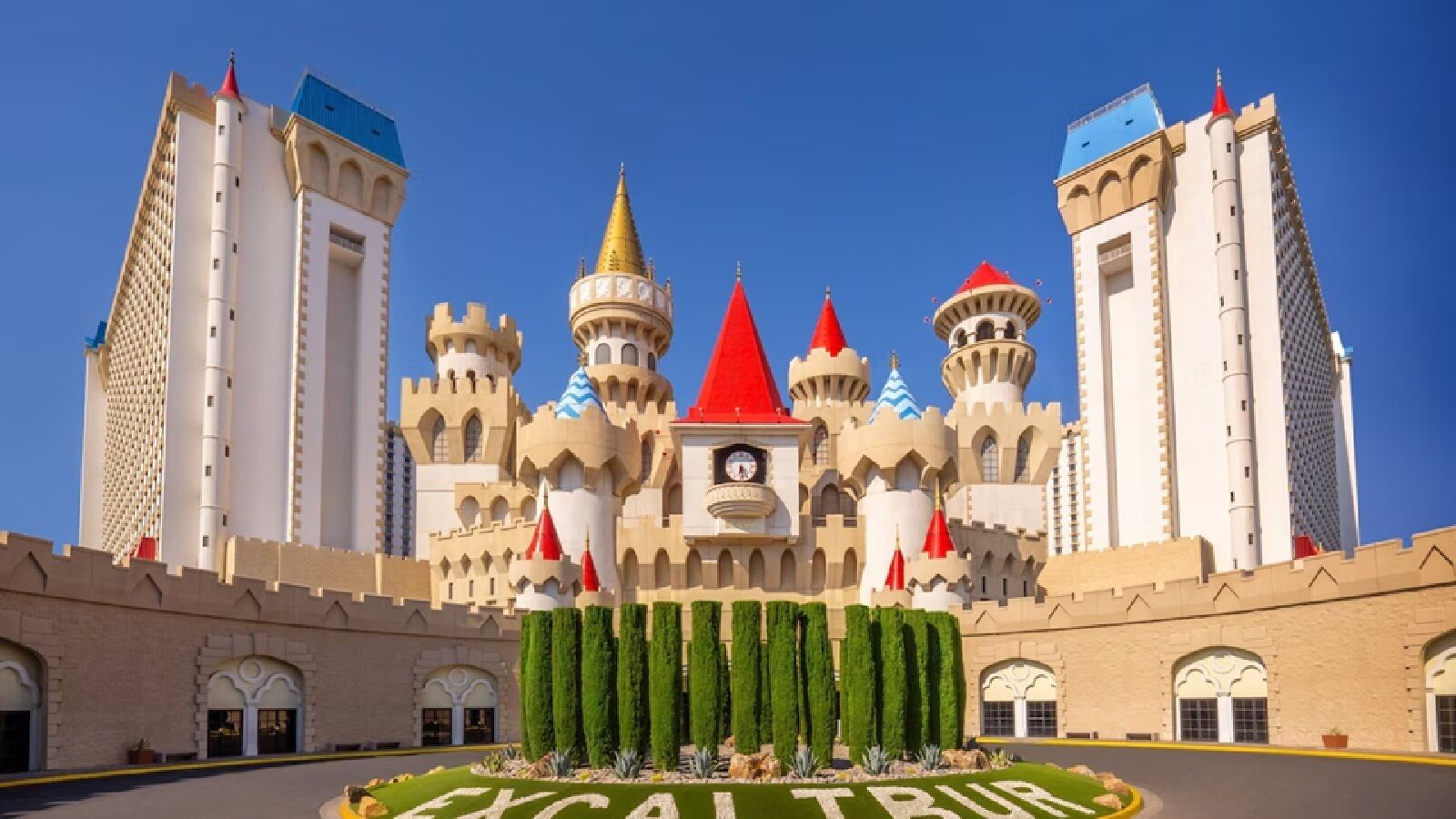 A castle-like building with multiple towers and a central clock tower.