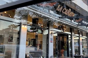 A storefront with a glass facade and a sign reading "LA CANADA".