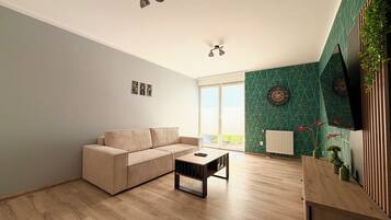 Una sala de estar moderna con un sofá color beige, una mesa de centro de madera y un ventilador de techo.