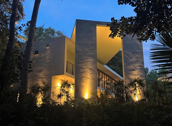 A modern building with a unique architectural design, surrounded by lush greenery. - The Sevana (Matara)