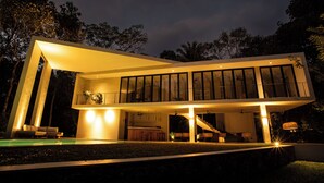 A modern two-story house with a pool, large windows, and a balcony. - The Sevana (Matara)