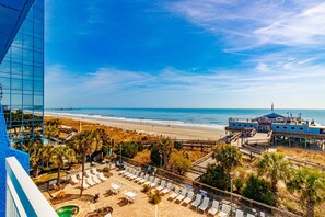 A beachside hotel with a pool, beach access, and a view of the ocean. - Yachtsman S504 Studio (Myrtle Beach)