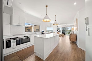 Fridge, microwave, oven, stovetop - The Boardwalk - Oceanview Unit on Bulcock Beach (Caloundra Region)