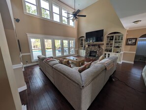 Living area - Stunning 4-Bedroom Retreat with Resort-Style Backyard in
 charming Evans. (Evans)