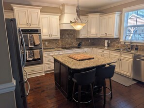 Private kitchen - Stunning 4-Bedroom Retreat with Resort-Style Backyard in
 charming Evans. (Evans)
