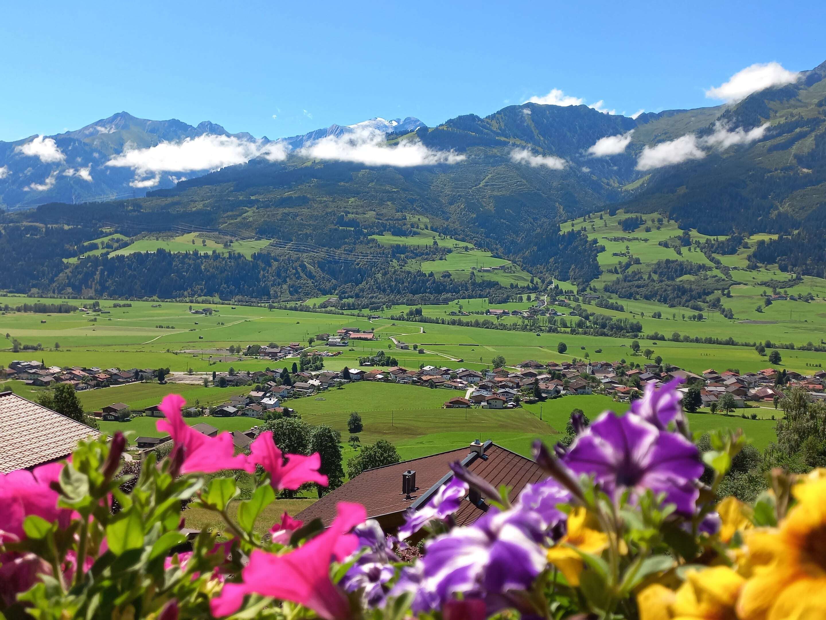 A mountainous landscape with a village and houses.