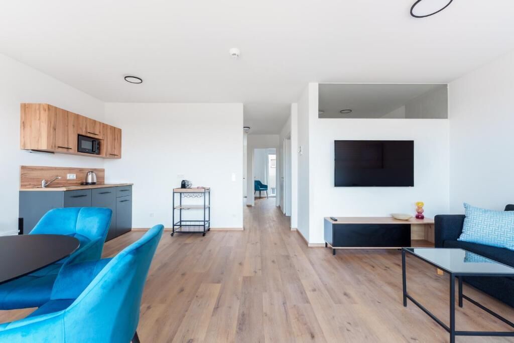 Apartment, Balcony, City View | Living area | Flat-screen TV