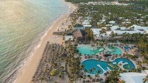 A resort with a beach, multiple swimming pools, and a view of the ocean. - Iberostar Waves Punta Cana (Punta Cana)