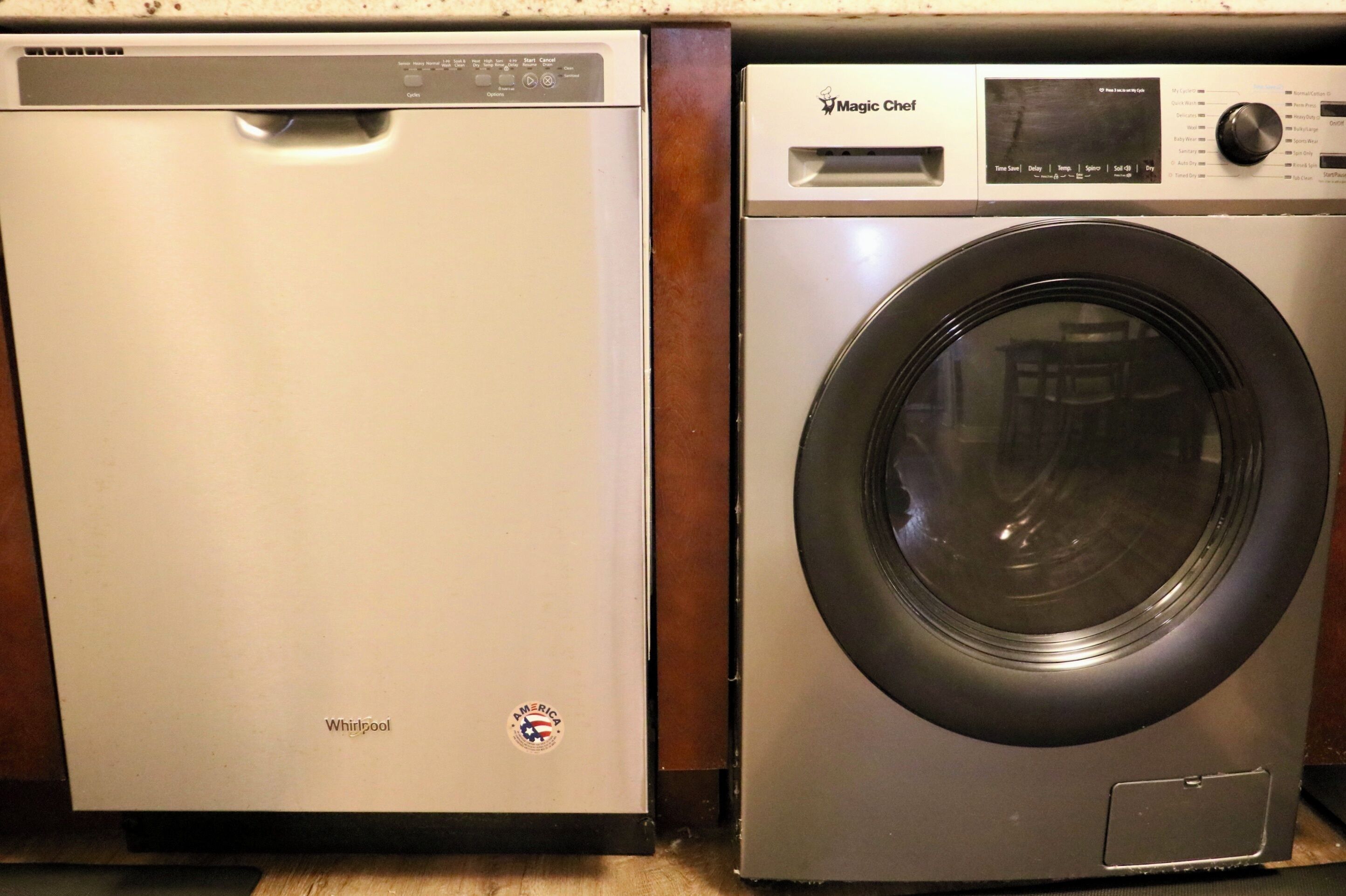 A Whirlpool dishwasher and a Magic Chef front-loading washer.