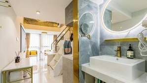 A modern bathroom with a white sink, a large mirror, and a vanity with storage. - Shanghai Stylish Loft with 2B (Shanghai)