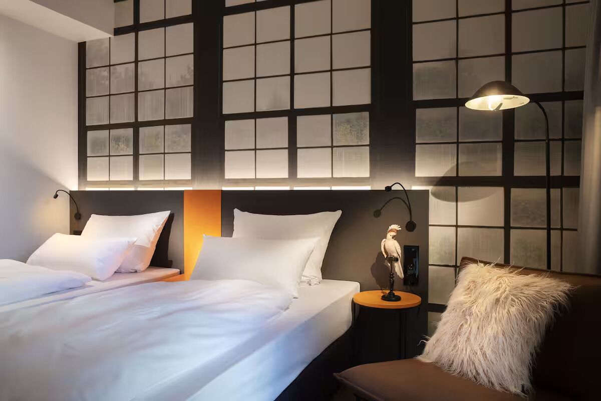 Relax with a book beside warm lighting and plush seating.
