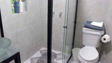 Shower, hair dryer, towels, soap
