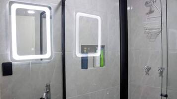 Shower, hair dryer, towels, soap
