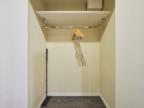 A small, narrow room with a wooden floor, a metal towel rack, and a white wall. - Triple Room NonSmoking Modular bath kitchenette free WiFi / Taitung District Tokyo (Taitung District)