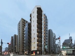 A multi-story building with a unique architectural design, featuring balconies and a mix of window patterns. - 1bedroom apartment nonsmoking separate bathroom and toilet kitchen washerdryer free WiFi / Taitung District Tokyo (Taitung District)