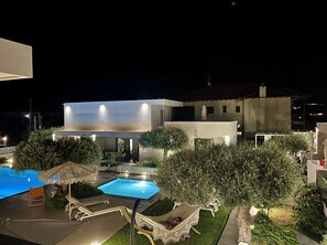 Seasonal outdoor pool, open 9:00 AM to 8:00 PM, pool umbrellas