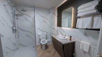 Bathtub, hair dryer, towels