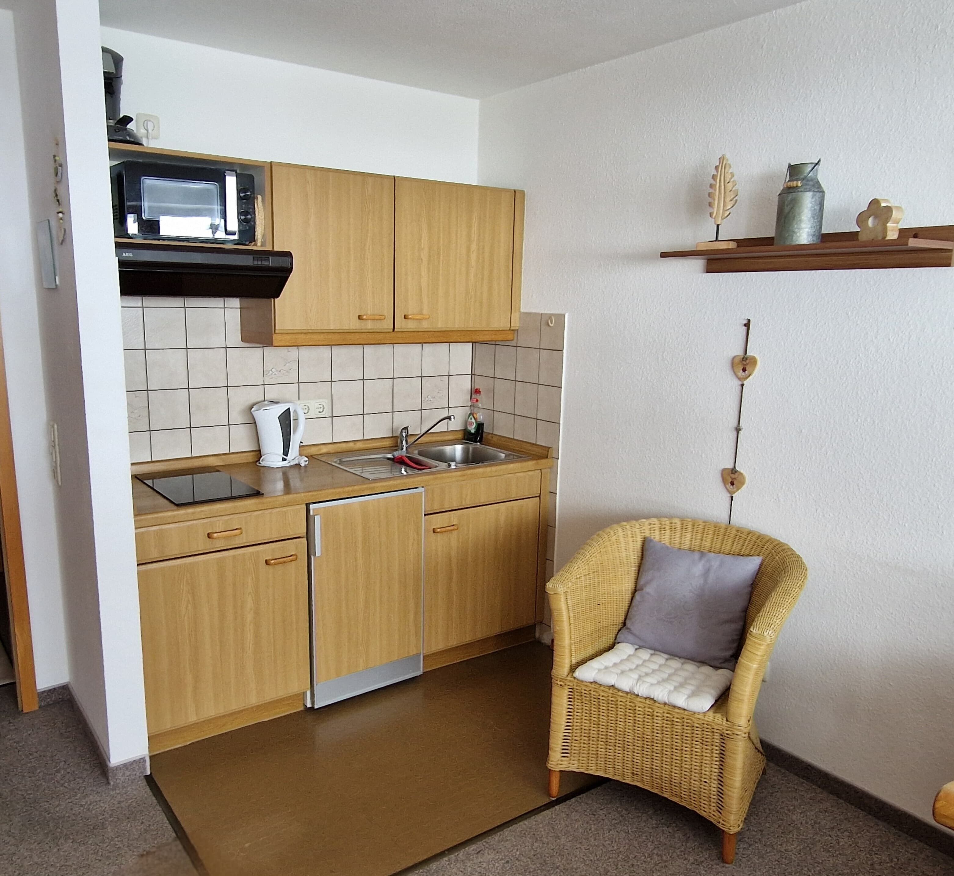Fridge, microwave, stovetop, coffee/tea maker