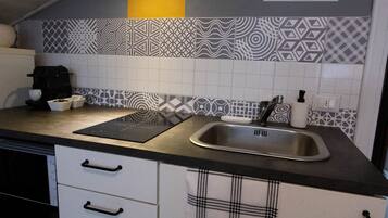 Fridge, microwave, stovetop, cookware/dishes/utensils