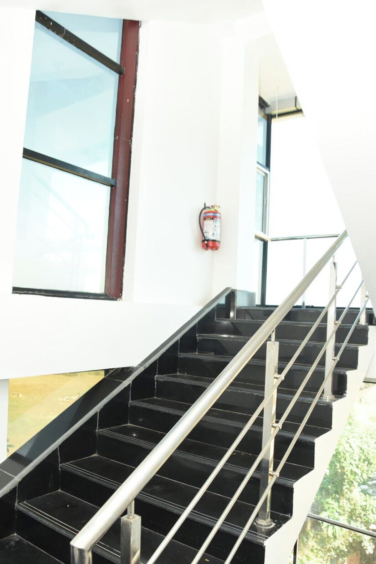 A staircase with metal railings leading to an upper floor.