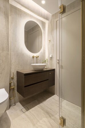 A modern bathroom with a marble vanity, a large mirror, and a glass shower enclosure. - Nikita 1 3rd·Signature Athenian Residence (Athens)