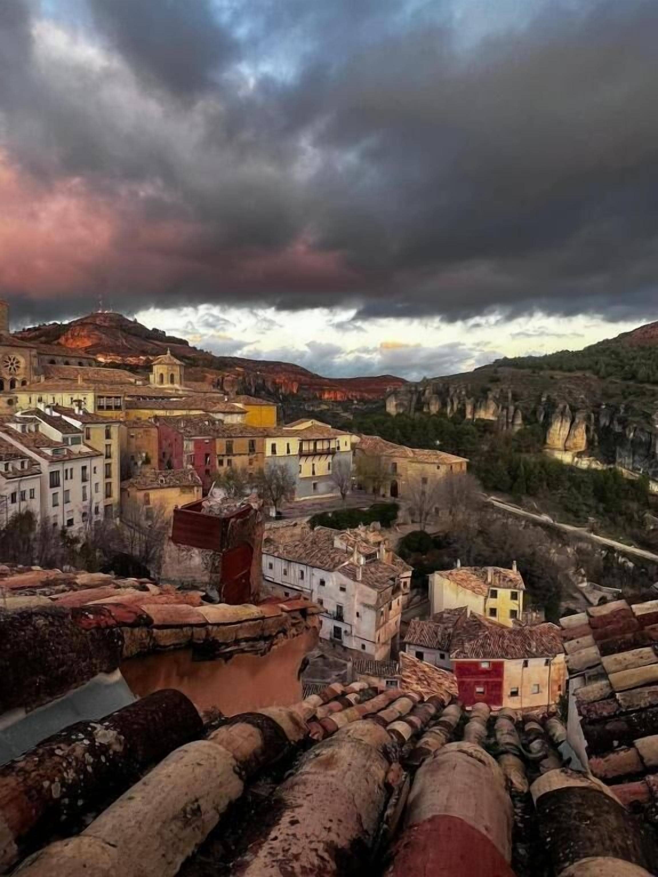 A town with buildings and a river.