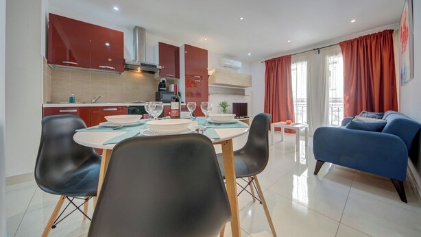 A modern apartment with a dining area, kitchen, and living room. - Off the Ferries, Sliema, 2-bedroom Apartment (Sliema)