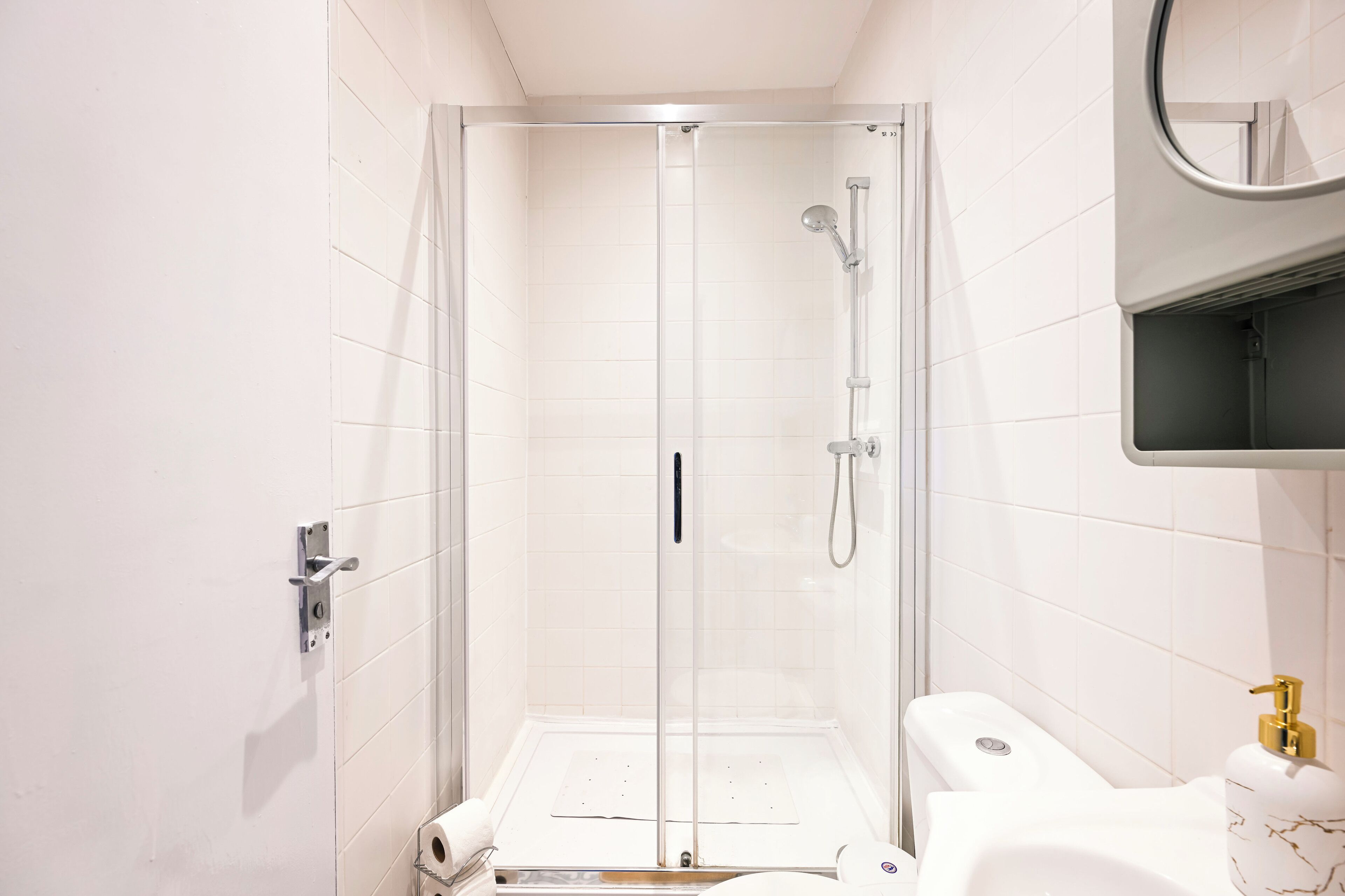 Shower, hair dryer, towels, soap