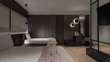 A modern bedroom with a bed, bedside table, and a TV.