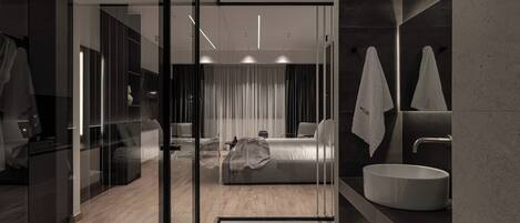 Junior Suites | Bathroom | Rainfall showerhead, free toiletries, hair dryer, slippers