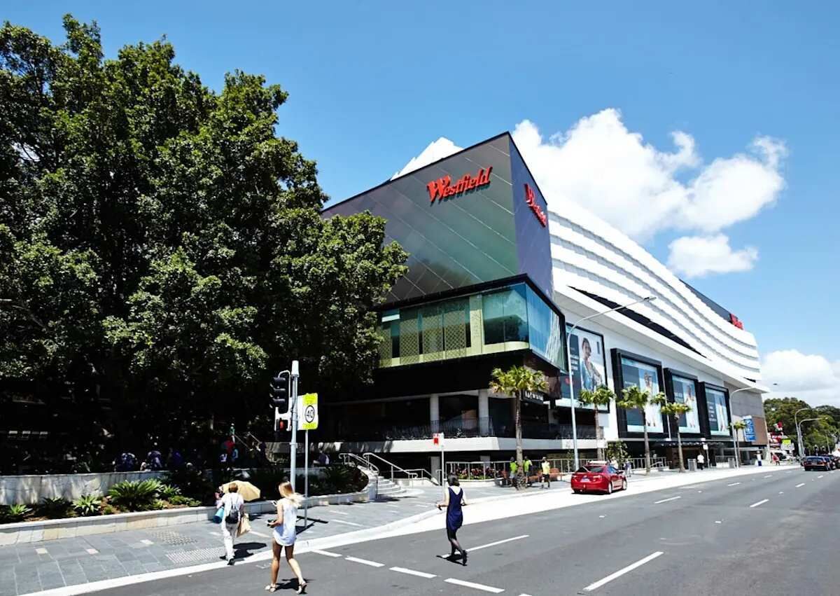 A Westfield shopping mall with a modern architectural design, featuring large glass windows and a prominent signage.